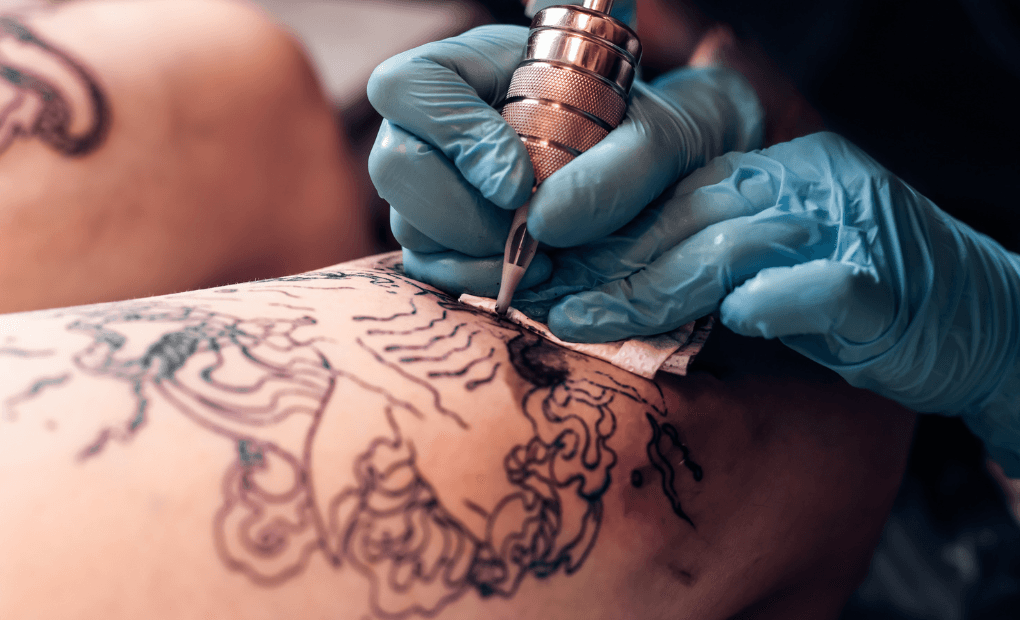 close up of persons skin being tattooed